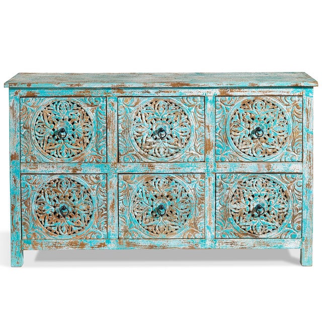 Handcrafted in India, this six-drawer chest showcases traditional artisanal techniques with its intricately carved floral...
