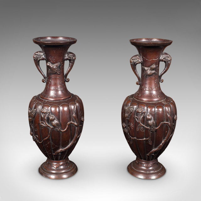 This is a pair of antique decorative stem vases. A Japanese, bronze Meiji era baluster urn, dating to the late Victorian...