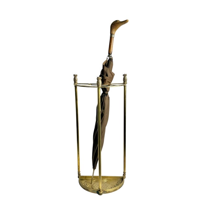 Charming vintage cast brass umbrella or stick stand with pineapple finials. Pineapple design on the base with Welcome.