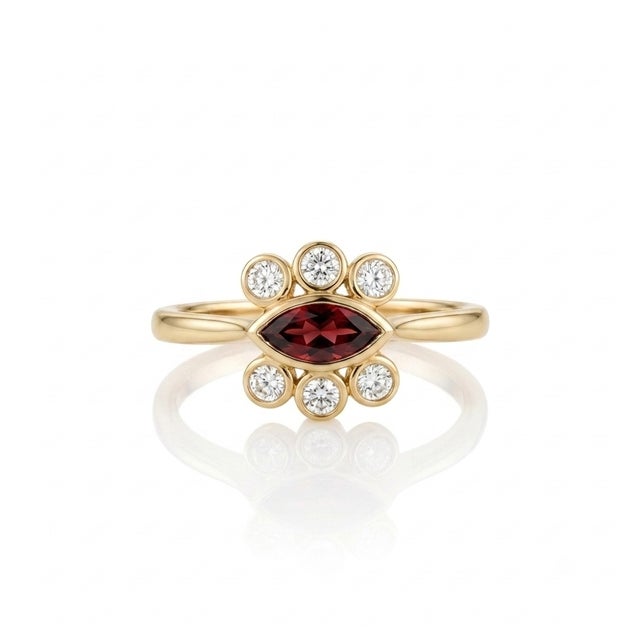 Embrace timeless elegance with this striking vintage-inspired marquise statement ring. Captivating at every angle, this...