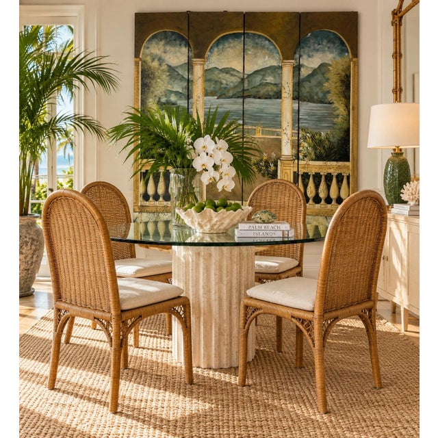Charming vintage dining chairs featuring beautifully woven natural wicker over sturdy metal frames. Designed with tall...