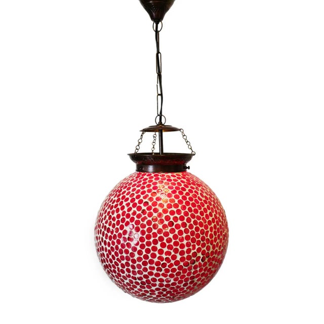 Cherry red mosaic globe pendant lamp. Hand crafted in India with intricate small colored glass mosaic work. Each varies...