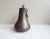 Antique container made of hammered copper with forged iron handle, pear-shaped with rounded ground. The handmade nails are...