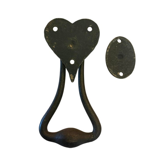 A great wrought iron door knocker in the shape of a heart is the perfect accent for the entrance to your home. This will...