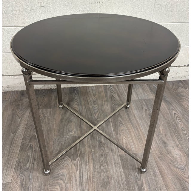 This is a beautiful vintage Milling Road by Baker Furniture round accent table featuring a beautifully finished dark...