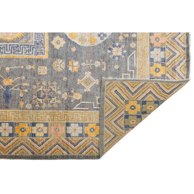 Elevate your space with this stunning Modern Khotan Style Handmade Wool Rug, a perfect blend of East Turkestan heritage...