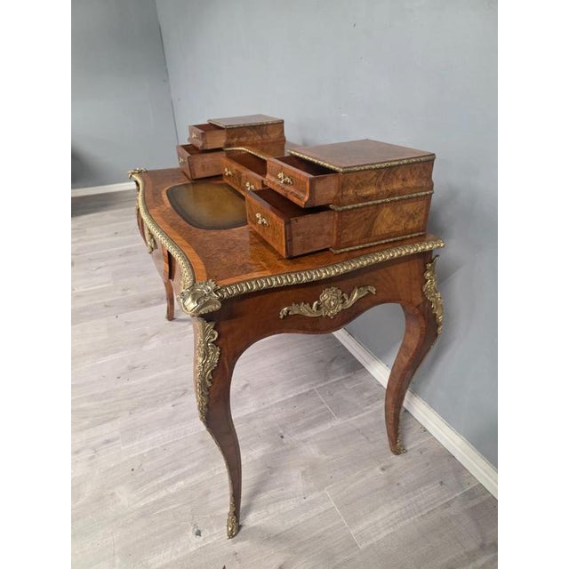 A luxurious and elegant piece of furniture for any office or study. The desk features a rich walnut colour with a leather...