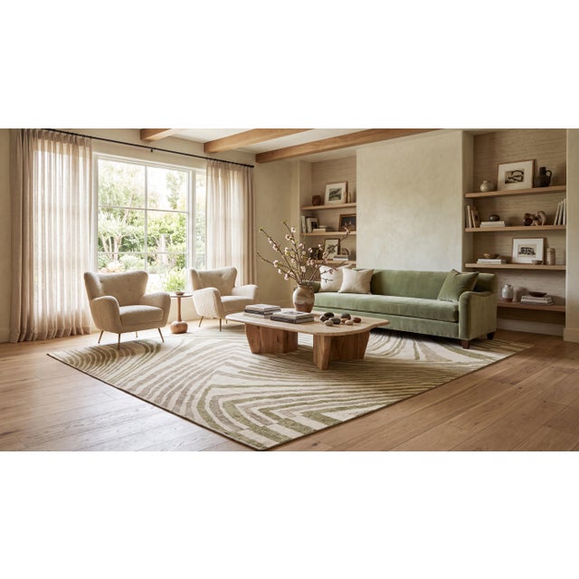 Elevate your interior with this exceptional contemporary hand-woven wool area rug, featuring a sophisticated abstract...