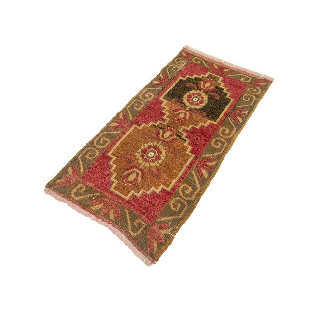 Vintage handknotted decorative mini rug from Konya region of Turkey. Approximately 45-55 years old. In very good condition.