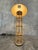 Handsome vintage bamboo and chrome floor lamp with real presence. Eight slender bamboo/rattan poles form an open cage...