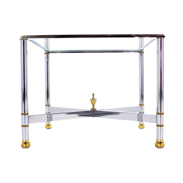 Brass chrome and glass tops tables with x bases.