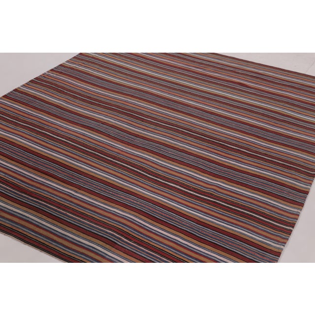 Made with handwoven wool circa 1950-1960, this 7x8 vintage Persian kilim and square rug is a particularly cheerful and...