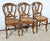 These period chairs in solid oak are distinguished by their S-arched crowbar legs supporting caned seats with scrolled...
