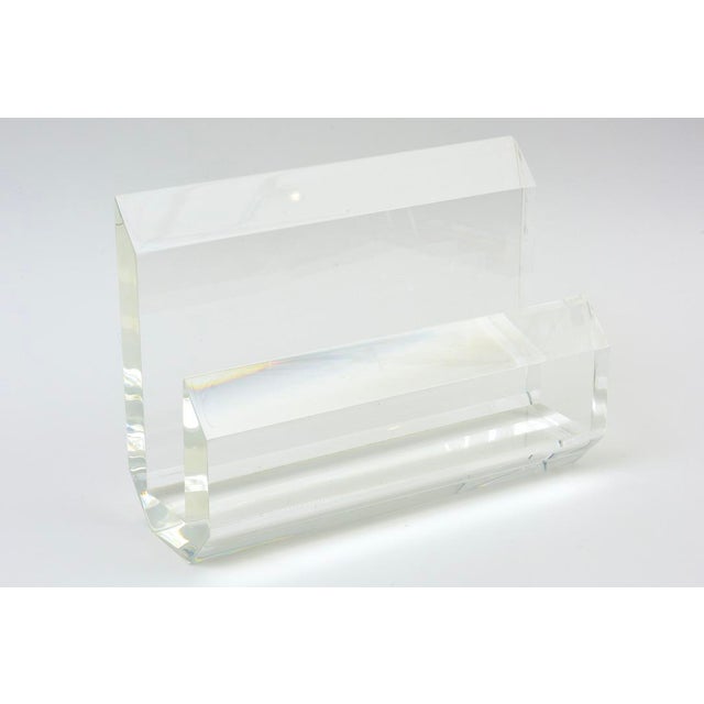 This ultra chic vintage Karl Springer lucite magazine stand has thick walled lucite. it is very modern looking and from...