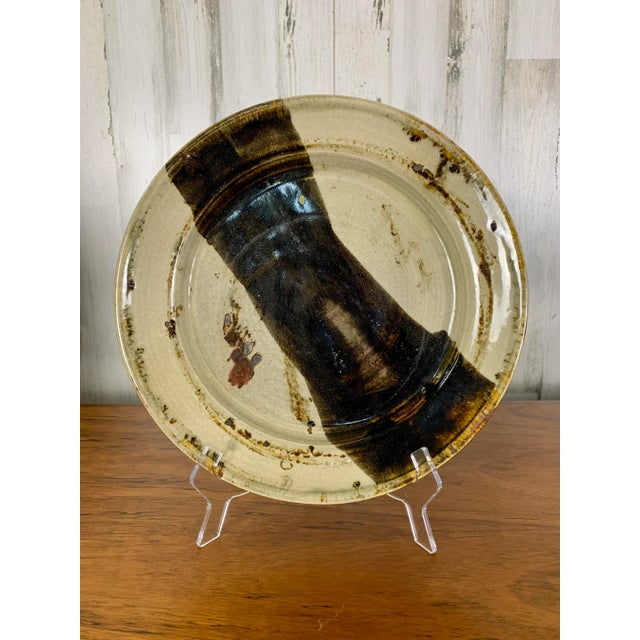 Studio crafted large plate / charger with abstract glaze.