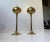 Matching pair of solid brass oil lamps. They feature onion shaped tops and trumpet shaped bases. Manufactured in...