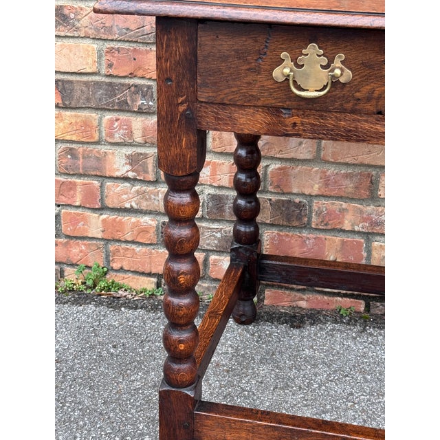 This is an excellent example of English craftsman ship. This 19th century, English side table features a single drawer,...