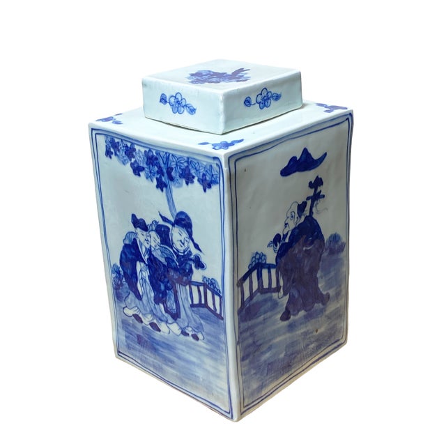 This porcelain ginger jar, measuring 12 inches tall and featuring hand-painted blue and white designs, beautifully...