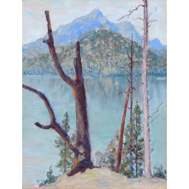 Scene of mountain reflections by Karl Albert Ufer (American, 20th century). Presented in a rustic wood frame. Signed "Karl...