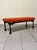 A 1960s-era upholstered bench, completely restored in Italy. Due to its features, it could also be considered an ottoman...