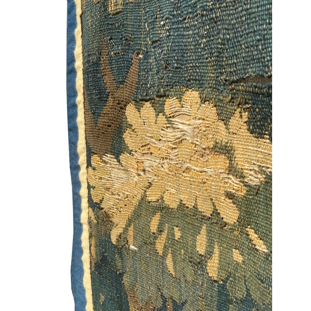 This exquisite antique Verdure tapestry is a true work of art, beautifully handwoven to depict a serene nature scene. The...