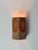 A beautiful set of three swedish wall sconces, dating to circa the 1980s, combining crisp architectural lines with the...
