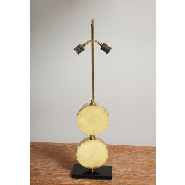 Pair of sculptural Mid-Century Modern brass disc lamps.