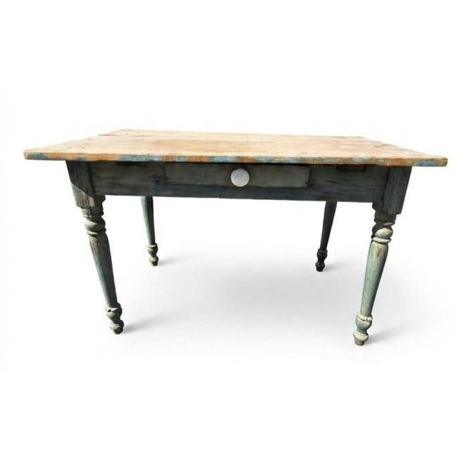 This item is an Antique Primitive Farmhouse Table (or Potting Table) with a weathered, two-tone painted base. Google