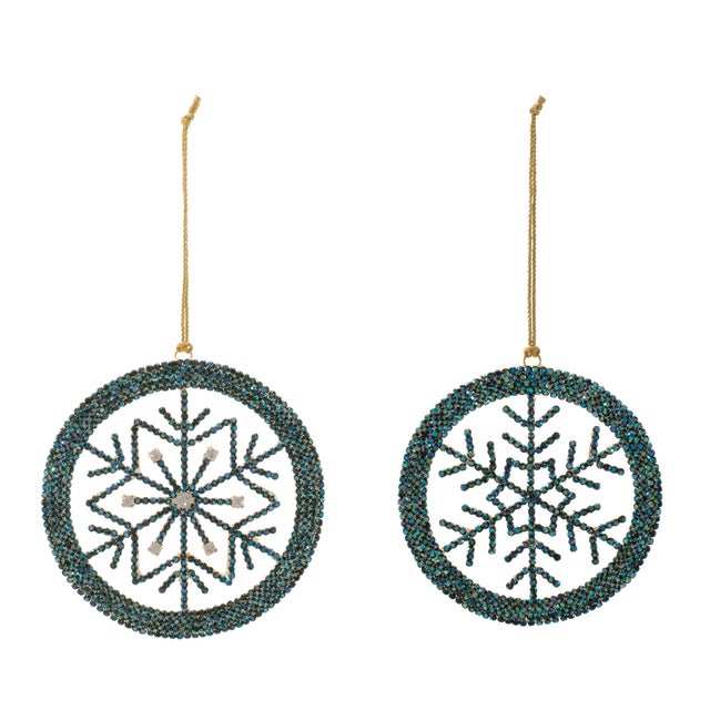 Add sparkling winter charm to your holiday décor with this Snowflake Ornament Set. Crafted from sturdy iron with acrylic...
