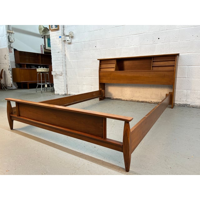 Bring timeless mid-century modern style to your bedroom with this beautiful walnut queen bed frame by Kent Coffey....