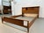 Bring timeless mid-century modern style to your bedroom with this beautiful walnut queen bed frame by Kent Coffey....