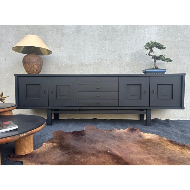 Striking Brutalist sideboard made of Belgian oak. Geometric elegance of 1960s furniture design. The piece is crafted from...