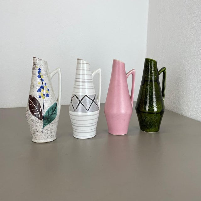 These original vintage vases was produced in the 1950s in Germany. It is made of ceramic pottery in fat lava optic. Super...