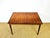 Magnificent walnut dining table dating from the 1960s. features two integrated butterfly extensions and beautiful grain...