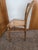 Handcrafted antique maple ladderback chair featuring a beautifully shaped double-rail back and an original hand-woven cane...