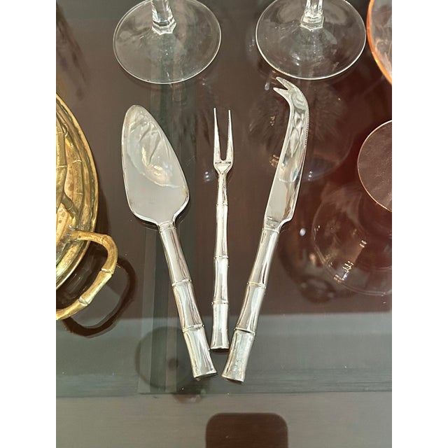 Elevate your charcuterie presentation with this vintage three-piece silver-plated serving set featuring classic faux...