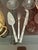 Elevate your charcuterie presentation with this vintage three-piece silver-plated serving set featuring classic faux...
