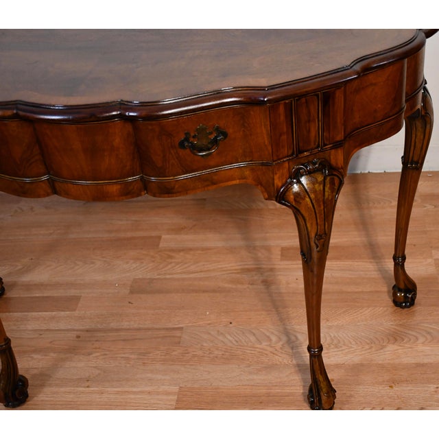 We are pleased to offer this beautiful English Regency console table, from the 1920. This console is made of burl walnut...
