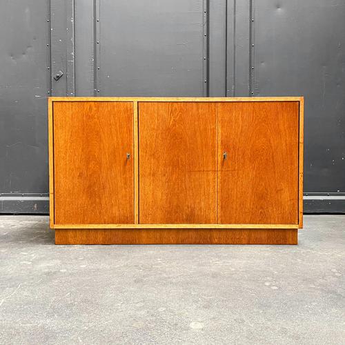 Product. Small sideboard. Style. Mid-century, 1960s. Material. Oak veneer. Features. Three doors, adjustable shelves on...