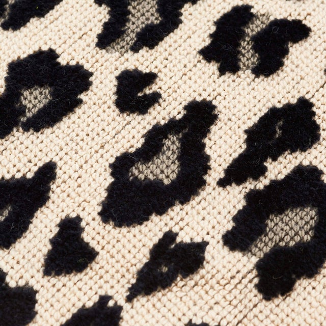 This 18" x 18" pillow features Safari Epingle in Snow Leopard with Gustave Silk Lip Cord in Black. A luxe epingle covered...