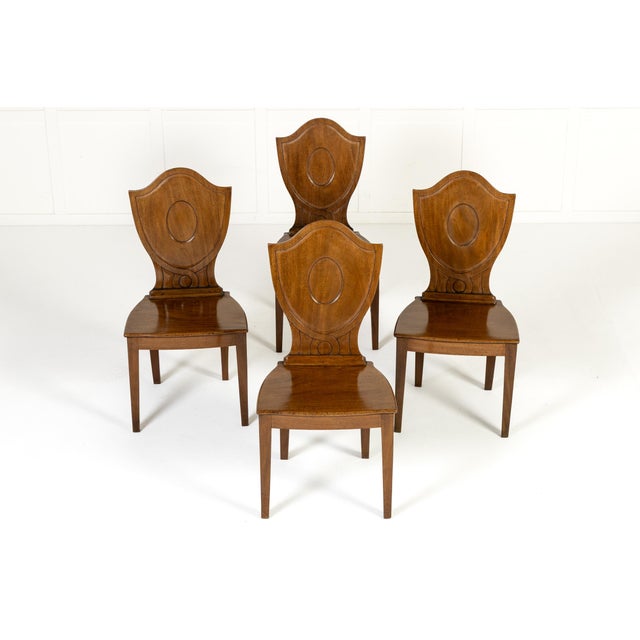 Set of four 19th century english regency mahogany hall chairs a set of four 19th century english regency mahogany hall...