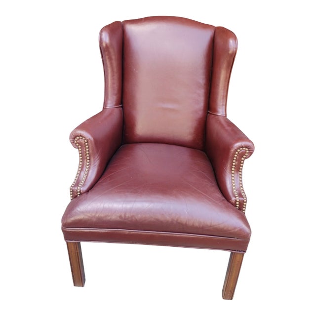 Experience Timeless Elegance of a Genuine Leather Wingback Chair by Kenyon Furnishings For Sale