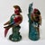 A vibrant vintage pair of China Trader hand-painted porcelain bird figurines. Exemplifying classic mid-to-late 20th-...