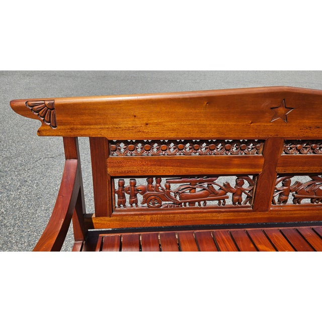This beautifully crafted wooden bench showcases traditional artistry and timeless design. Made from richly polished...