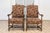 This beautiful pair of 20th-century French armchairs exudes timeless elegance and traditional craftsmanship. The chairs...
