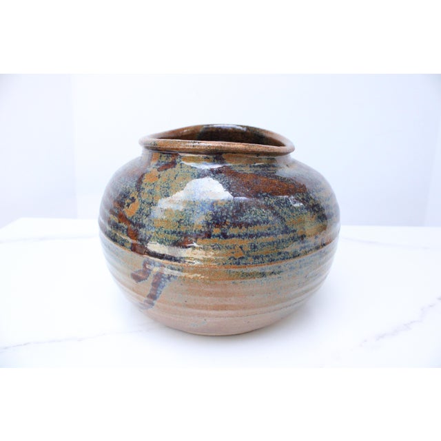 Handmade vintage decorative art bowl with desirable multi color hue and glaze finish. We love it's one-of-a-kind...