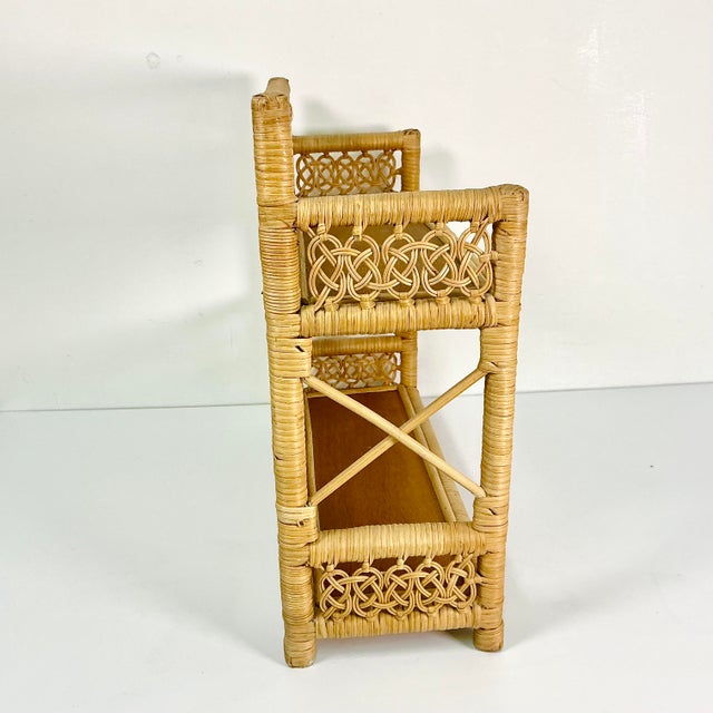 This wicker wall-mounted shelf features a double knot loop design as well as the traditional wicker weave. It’s two...