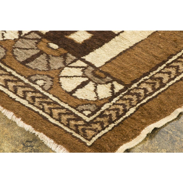 Hand-knotted in wool, this 5x8 contemporary French rug features a modern, cubist-inspired layout of swirling volutes,...