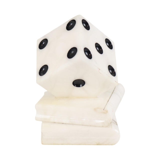 Vintage die paperweight or figurine, crafted from natural alabaster stone. It depicts two stacked books topped with a...