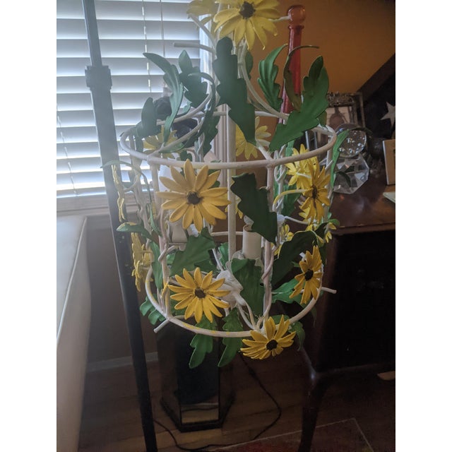 Bring cheerful cottage charm to your space with this whimsical vintage tole chandelier featuring hand-painted black-eyed...